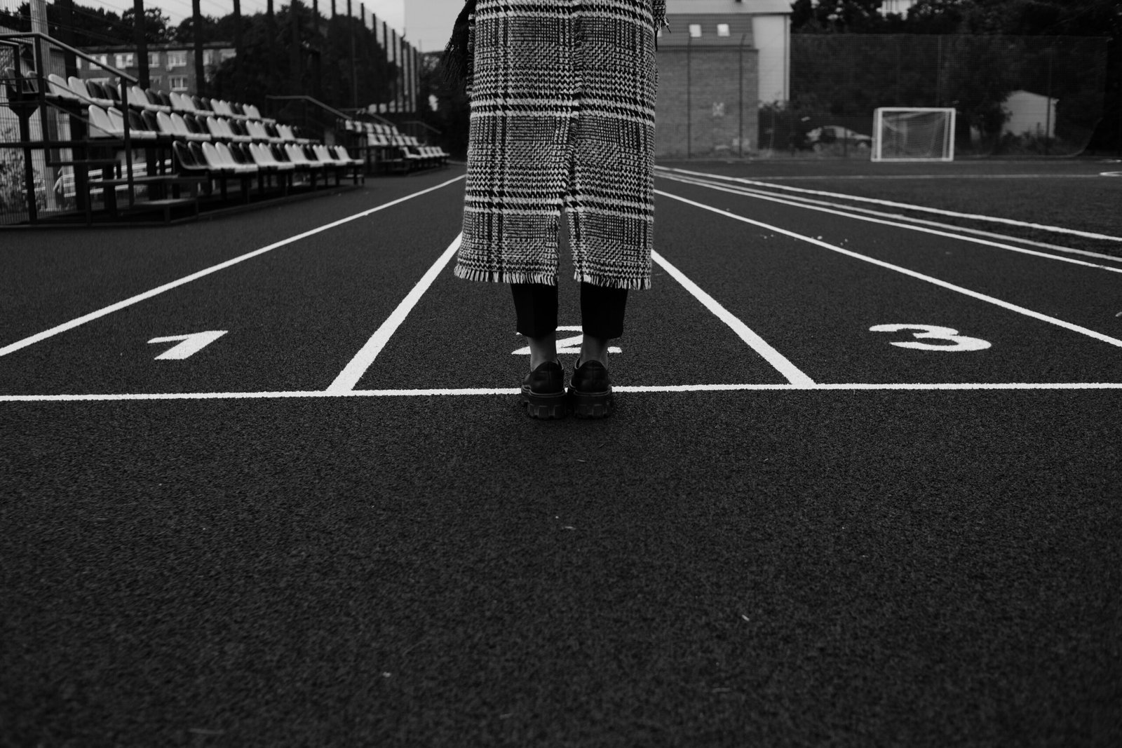 a person standing in the middle of a parking lot